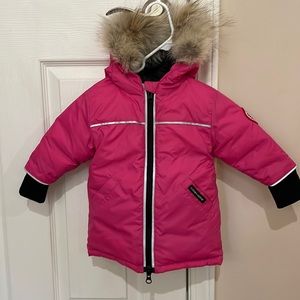 Pink Canada Goose jacket with fur trim hood.